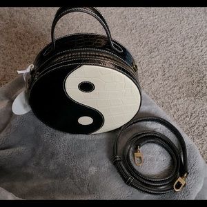 STAUD crossbody, black and cream color.